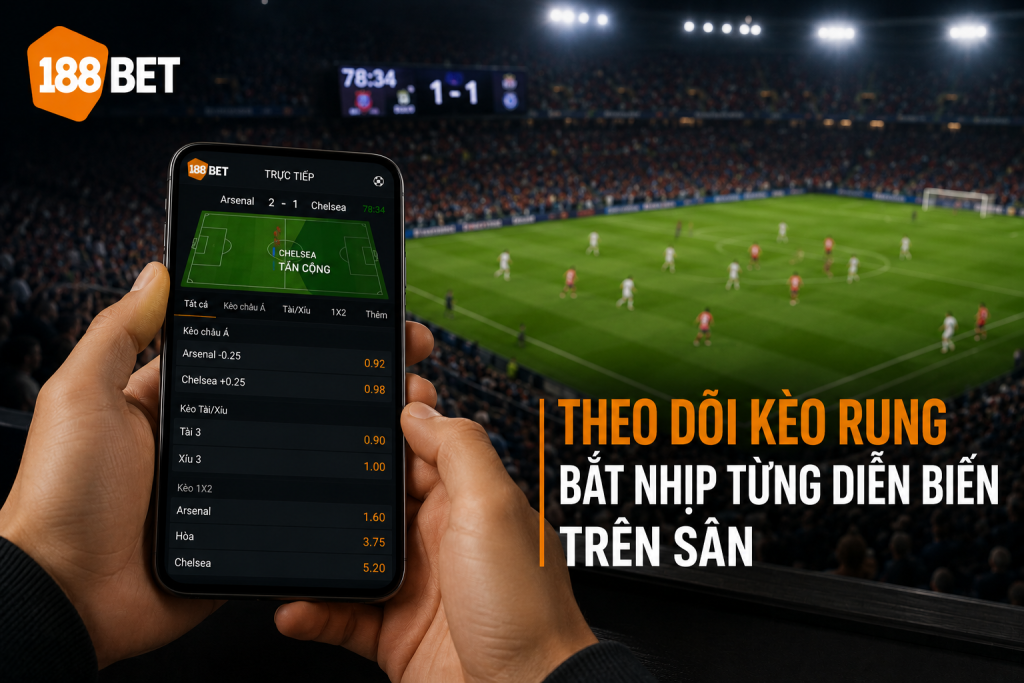 Cược thủ theo dõi kèo rung trực tiếp trên điện thoại trong trận bóng đá